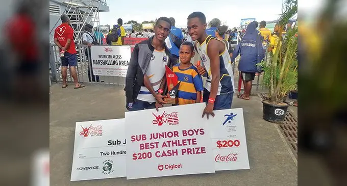 Cuvu College’s Aporosa Lalabalavu (right) with his award after he was named the best athlete in the sub jnior boys division at the HFC Bank Stadium, Suva, on August 20, 2022. Photo: Sereana Salalo