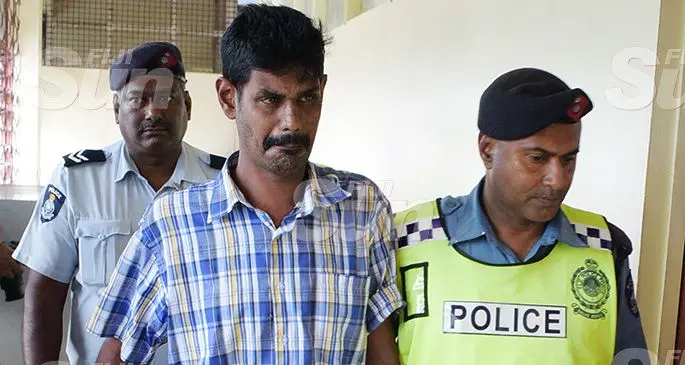 Bus driver, Salesh Jattan is escorted by Police officers at the Magistrates Court in Nausori during a special court sitting on October 12, 2019.Photo: Ronald Kumar