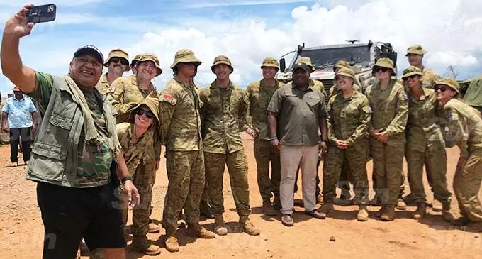 Prime Minister Voreqe Bainimarama takes a selfie with Minister for Defence, National Security and Policing, Rural and Maritime Development and Disaster Management Inia Seruiratu and the Australian Defence Forces personnel at their base near Bekana Jetty in Bua on January 13, 2021. Photo: Shratika Naidu