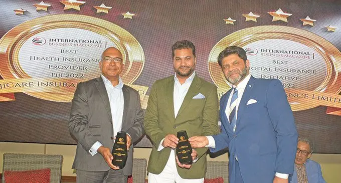 From left-Fiji Care Chairman Dumith Fernando and Executive Director Avi Raju receive their international award from acting Prime Minister and Attorney-General Aiyaz Sayed-Khaiyum during FijiCare’s 30 year celebration at the GPH on June 29, 2022.  Photo: Ronald Kumar