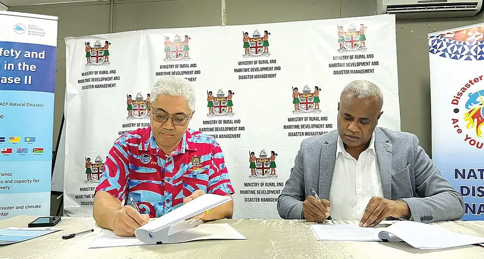 Secretariat of the Pacific Community (SPC) deputy director, Dr Paula VIvili and Permanent and Secretary for Rural and Maritime Development Isoa Taleimaibua signing a Memorandum of understanding in Suva on March 19, 2024. Photo Jone Salusalu 