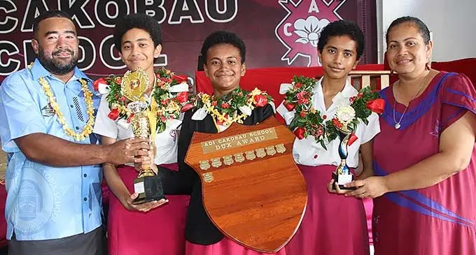 Adi Cakobau School (ACS) dux for 2023, Sainimili Bainivalu (middle), with parents Semisi {left) and Siteri (right) and her sisters Jimaima and Karalaini. Photo: Sosiveta Korobiau