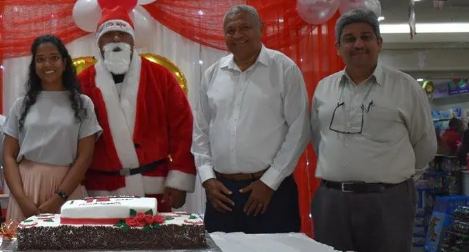 Celebrating 12 years since the big MHCC Complex in downtown Suva opened. From left: Carpenters Fiji Limited director Shanti Lourdenadin, Santa Claus, Carpenters Fiji Limited managing director Daniel Whippy and Carpenters Shipping general manager Hoshnever Trombaywalla on December 12, 2019. Photo: Shaamal Sami