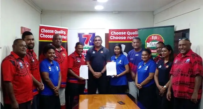 Marist Rugby Club president Lawrence Tikaram (fifth from left) and Future Farms Pte Limited Trading as Rooster Poultry chief executive officer Stanley Raniga (sixth) with members of the Marist Rugby Club and staff of Future Farms Pte Limited Trading as Rooster Poultry on March 3, 2023. Photo: Salote Qalubau