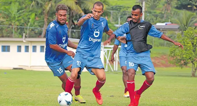 Tevita Waranaivalu (middle) carries the ball away from Ilisoni Logaivau (left) and Abbu Zahid (right) during the Fijian men’s football national training squad members camp at the Fiji Football Academy in Ba last month. Photo: Fiji FA Media
