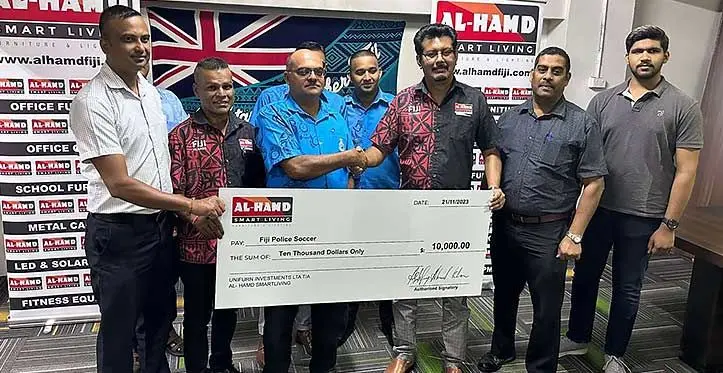 Fiji Police Soccer (Football) Committee president Superintendent Nilesh Lakhan (third from left) receives the sponsorship cheque from Hamd Smart Living managing director Ashfaaq Ahmad Khan in company’s outlet in Raiwaqa, Suva, on November 21, 2023. Photo: Leone Cabenatabua