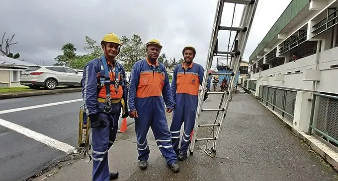 EFL technical crew (from left) Rigamoto Kava , Saula Mataibeci and Edward Sanday working on a power fault near the Colonial War Memorial Hospital in Suva on February 6, 2021.  Photo: Shalveen Chand 