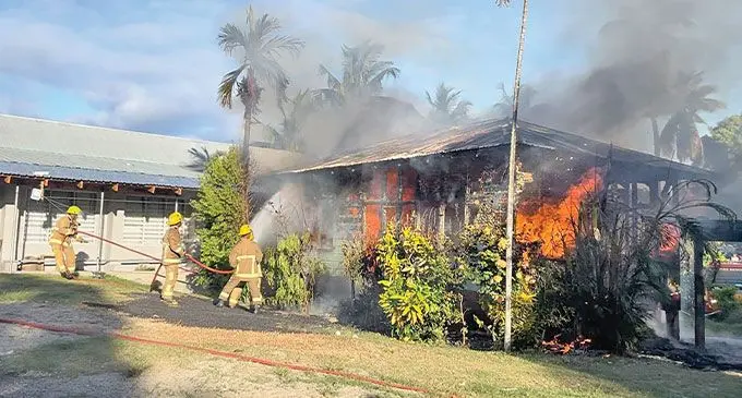 Fire fighters attending to a house fire. Photo: Waisea Nasokia