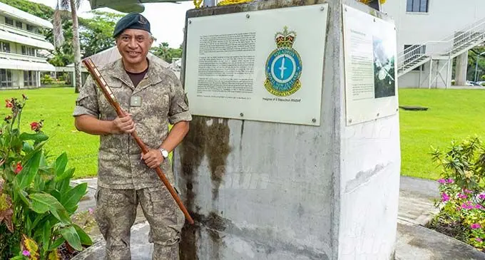 The ‘Stick’, NZDF Adviser Lieutenant-Colonel Josh Wineera in front of the Commemorative Monument to the 5 Squadron of the Royal New Zealand Air Force (RNZAF) at the University of the South Pacific. Photo: Leon Lord