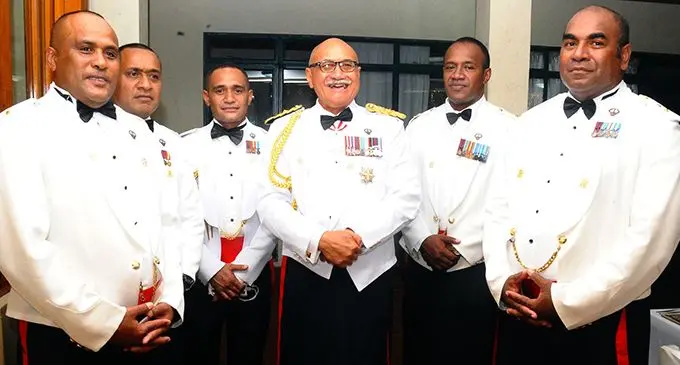 Major Aseri Rokoura (1st from left) and Lt. Colonel Penioni Naliva (1st from right) with the President of Fiji H.E Major General (ret'd) Jioji Konrote and other Officers at an event at QEB earlier this year