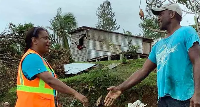 Suli reaches out to a villager and assures them of Government’s support in their time of need. Photo: Ministry of Forestry