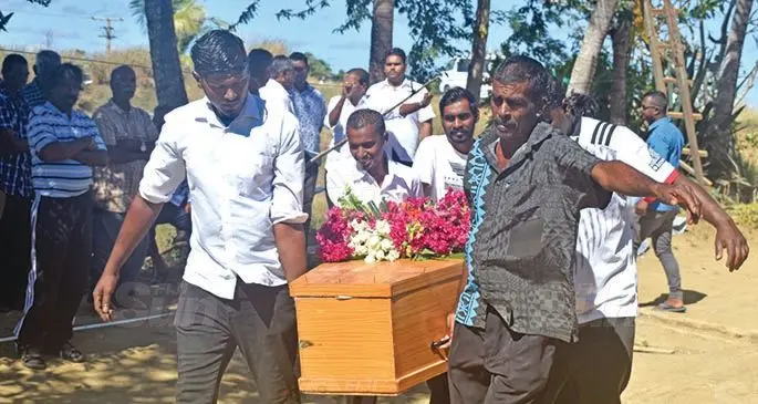 Pallbearers carry the casket of late Sunita Devi for her final rites at her home at Sonaisali, Nadi on Monday. Photo: Waisea Nasokia