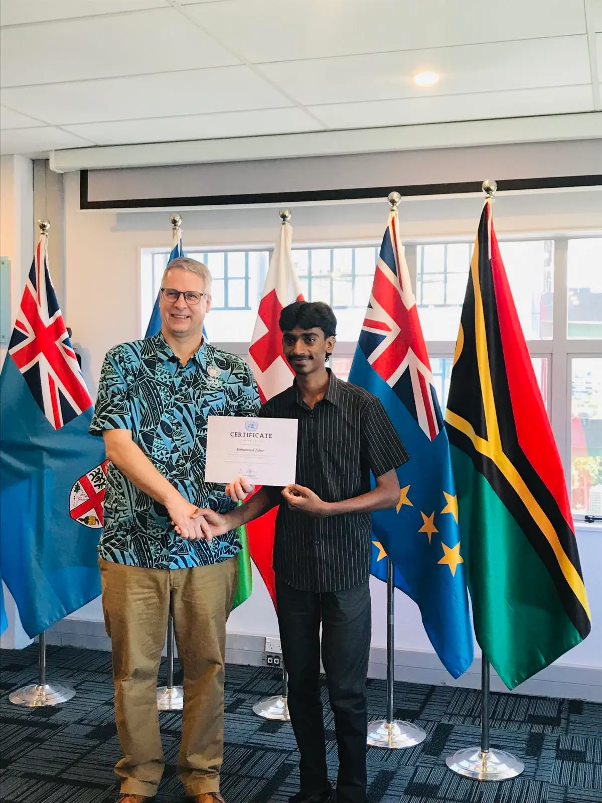The UN Resident coordinator in Fiji, Solomons, Tuvalu, Tonga and Vanuatu, (Dirk Wagener) with the 1st Category Winner – Senior Category in the Pact for the Future Essay Contest, (Mohammed Zuber) during the  Pact for the Future, Youth Essay Awards Ceremony at Kadavu House on April 1st, 2026.