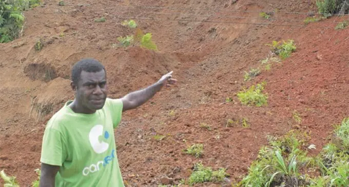 Senivalati Nasonua from Tobu village in Wainibuka, Tailevu pointing at the landslide in Malabe along the Kings Highway on April 27,2019. Photo: Simione Haravanua