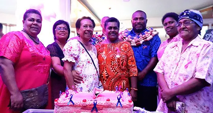 Cancer  survivors cut the cake at the Tanoa Pinktober launch with Health Minister Dr Ifereimi Waqainabete. Photo: Wati Talebula