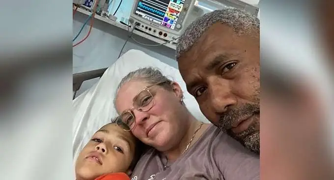 Malakai Luma with his parents.