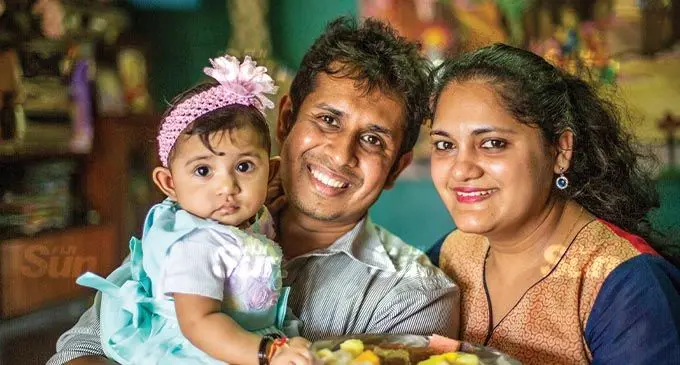 From left: Eight-month old Aahana with proud parents Edwin and Aashna Maharaj in Vatuwaqa. Photo: Leon Lord.
