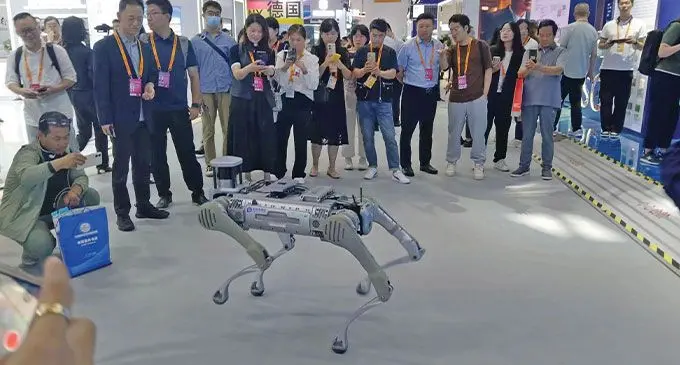 A robot that is built like a dog impresses customers at the Trade showcase. Photo: Tabutei Prasad