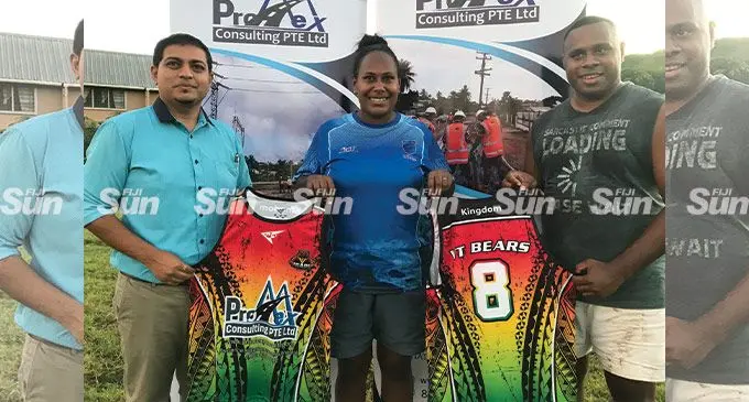 Promex Consulting Limited director Lawrence Kumar (left) hands over the kits to Luse Vulavou and Josevata Davui on April 14, 2022. Photo: Waisea Nasokia