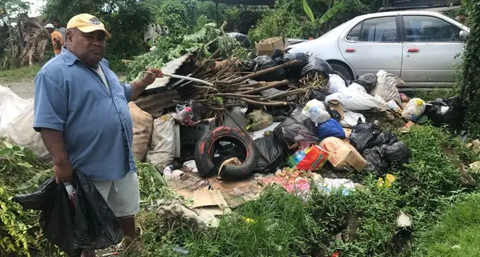 65-year-old Samuela Waqaniburotu beside the heap of rubbish at the Muanikoso Settlement in Nasinu on February 22, 2018. Photo: Selita Bolanavanua
