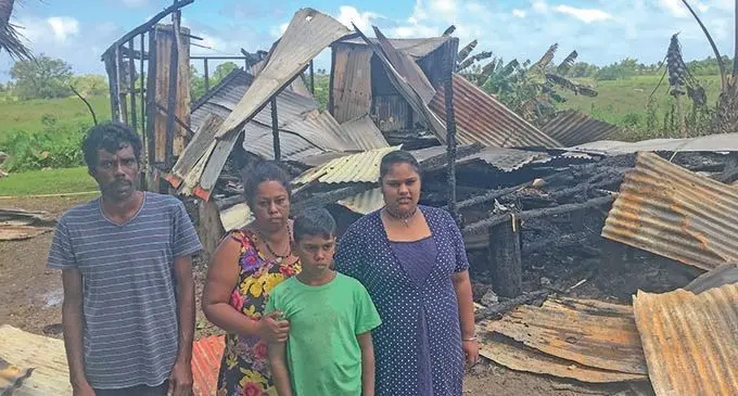 Parveen Chand stands with his wife Ashika Chand and children Astha Chand and Palvish Chand in front of their home that was destroyed by fire in Nasasa, Navua on  October 12, 2020.  Photo: Kelera Sovasiga