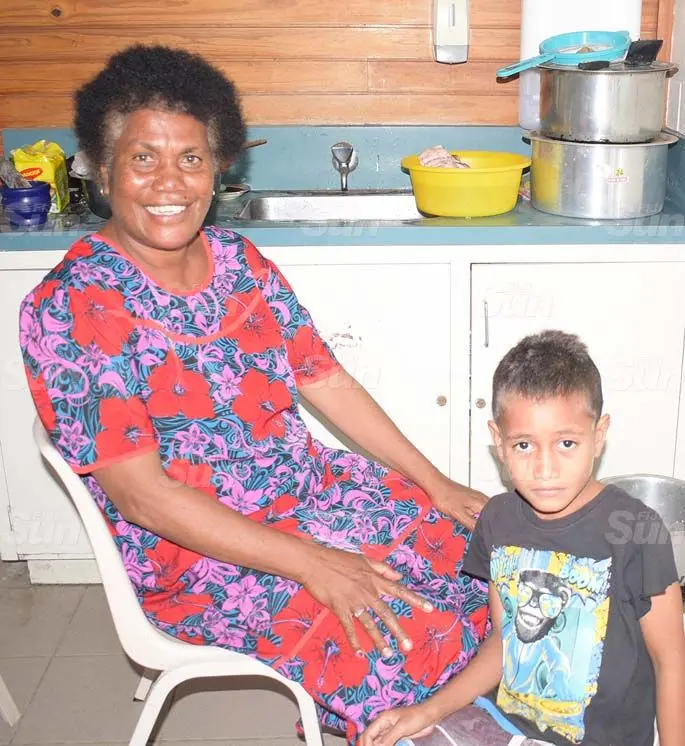 Mere Doro with her grandson, Keli Petero at LDS evecuation centre in Navua . Photo: Ronald Kumar.