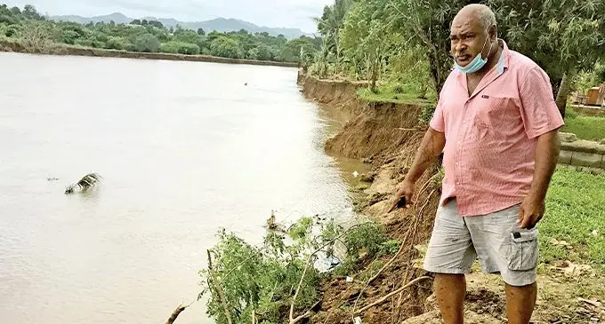 Meli Cabebula shows the eroded land at Yavusania Village in Nadi. Photo: Waisea Nasokia