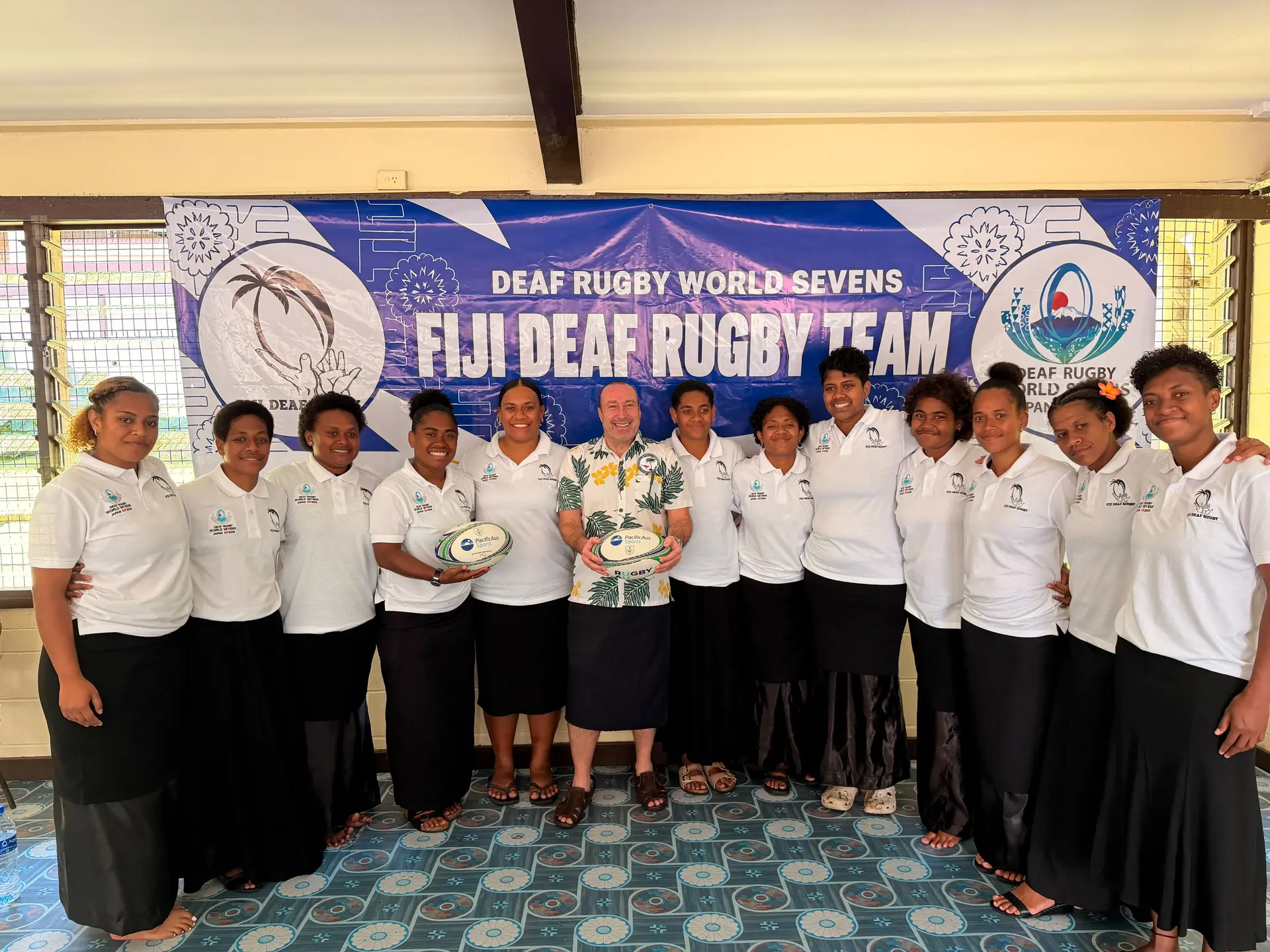 Australian High Commissioner to Fiji Peter Roberts (sixth from left) with the national women's deaf rugby team. 