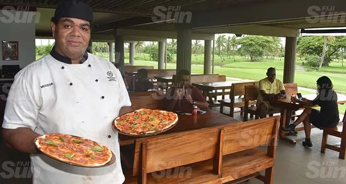 Chef Mosese Seru with the pizza at the Heineken House on Denarau Island yesterday. Photo: Waisea Nasokia