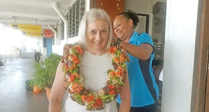 Fijian Pearls coach, Jenny Brazel, is garlanded by Netball Fiji administrator, Kinisalote Drasuna upon her arrival at Nausori International Airport on March 8, 2021.  Photo: Sereana Salalo