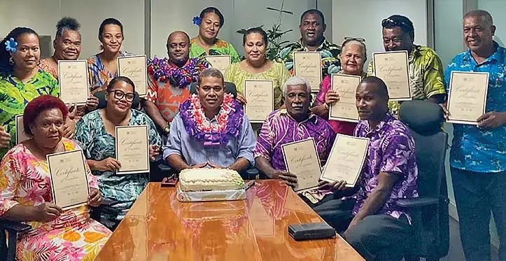 Ministry of Trade’s director of Integrated Human Resource Development Programme Iosefa Koroidimuri (sitting wearing garland) and trainer Aslam Khan (standing wearing garland) with the 13 microentrepreneurs who undertook a three-day training course and were recipients of the Trade Enhancement Programme grants. Photo: Jernese Macanawai