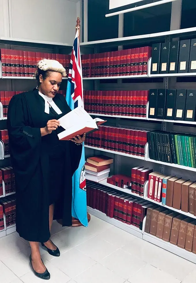 Susan Serukai (right) at work.