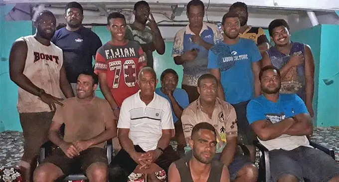 MV Liahona II Captain Akuila Cama (seated second from left), and his crew.