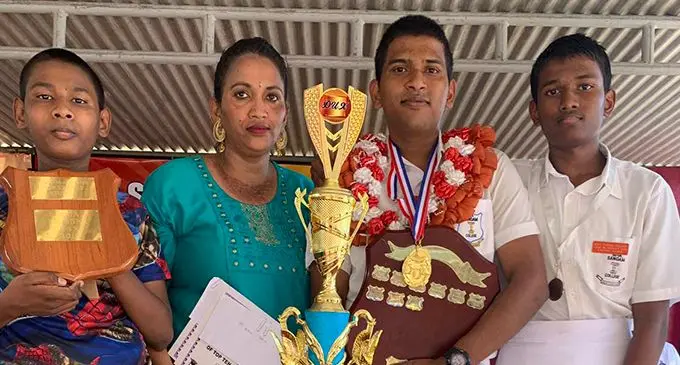 Subhal Krishna Chand  of Suva Sangam College with his mother Anuradha Mani and two brothers Kaushal and Shivneet at the prize giving ceremony on October 9, 2019. Photo: Shazleen Bano