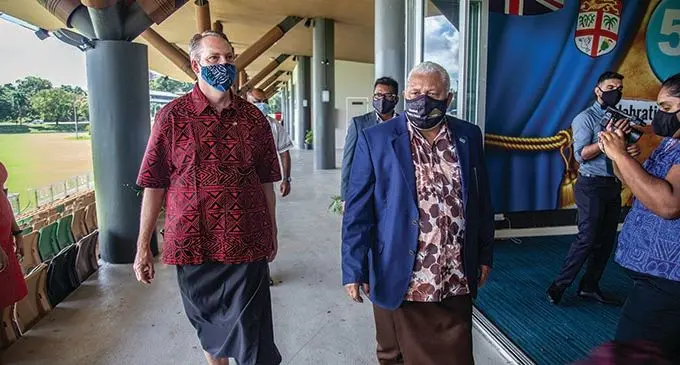 US Chargé d’Affaires Tony Greubel (left) with Prime Minister Voreqe Bainimarama at Albert Park in Suva on July 22, 2021. Photo: Leon Lord