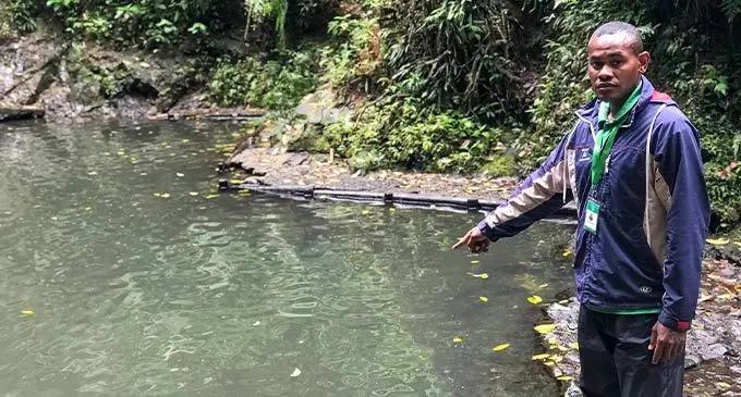 Park ranger Amini Tuilau, on September 19, 2022, points to the pool where the two brothers, Mohammed Ifraz Faruq and Abdul Moiz, were found at Colo-i-Suva on Sunday. Photo: Nacanieli Tuilevuka
