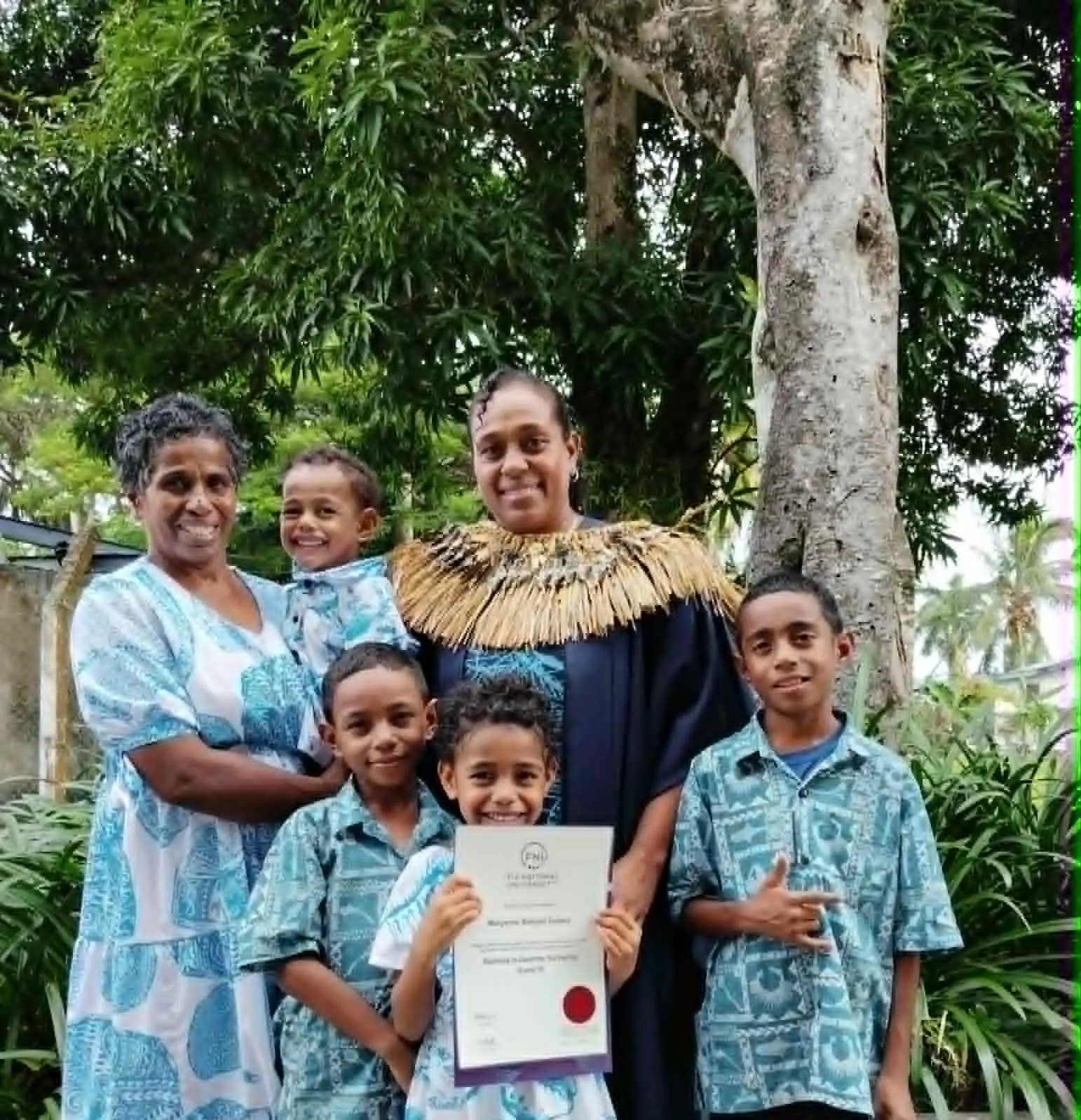 Maryanne Delana, along with her mother (from left) with her children during the Fiji National University graduation.