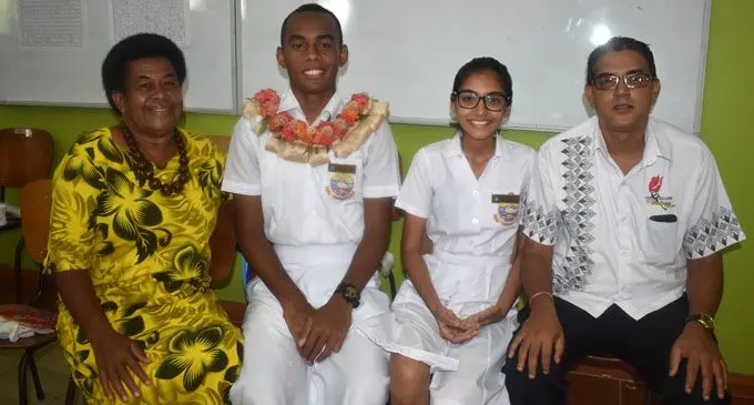From left: Tarusila Rasala with grandson and Swami Viveknanda College Headboy Apimeleki Rakele and headgirl, Priyanka Mishra with her father, Navneet Mishra, after the school's prefect induction ceremony on February 8, 2018. Photo: Arieta Vakasukawaqa