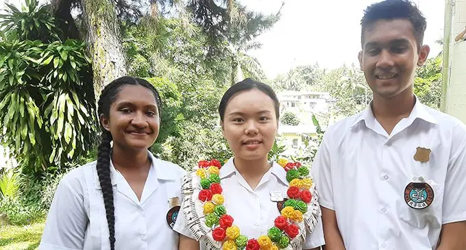 From left; Lydia Kondaiya (deputy head girl), Janey Du (head girl) and Shay Prasad (deputy head boy) after the Yat Sen Secondary School prefects induction ceremony on February 6, 2020. Photo: Shreeya  Verma