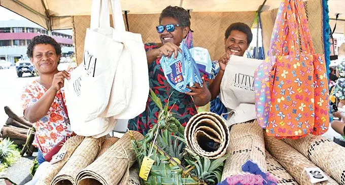 From left: Adi Kamanalagi, Sainimili Bebe and Mereani Nalewato, members of the Amania Women's Group of Wainibuka, Tailevu, during the Market Day at Suva's Civic Centre carpark on December 19, 2024. Photo: Ronald Kumar