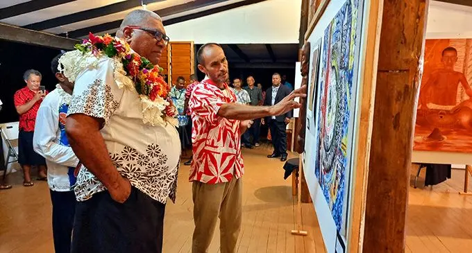Josaia McNamara explains his work to President Ratu Wiliame Katonivere during the opening night of the inaugural Savusavu Art and Fashion Week on March 28, 2023. Photo: Sampras Anand