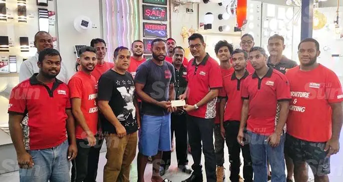 Savenaca Naliva (front, third from left) receives the sponsorship cheque from Al-Hamd Smart Living managaing director Ashfaq Khan in Nadi on January 15, 2021. Photo: Waisea Nasokia