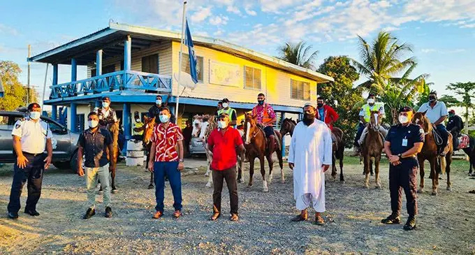 Ratu Meli Derenalagi (in pink shirt) on horseback with senior police officers and CPC advisors at Nawaka in Nadi.