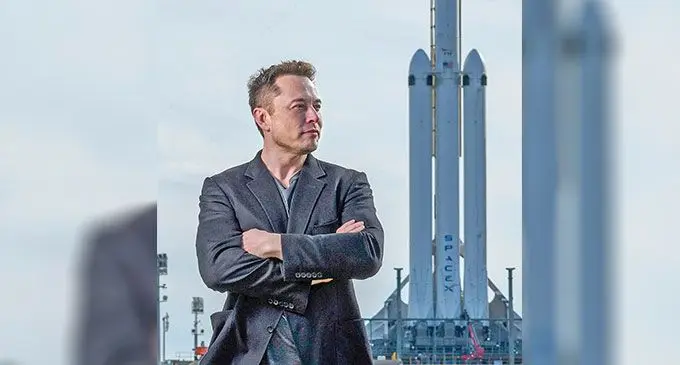 SpaceX Starlink owner Elon Musk standing in front of a SpaceX rocket. Photo: BBC