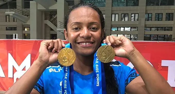 Team Fiji women’s swimmer Matelita Buadromo proudly shows her two gold medals won during the Pacific Games rin Apia, Samoa on July 11, 2019.  Photo: Rosi Doviverata 