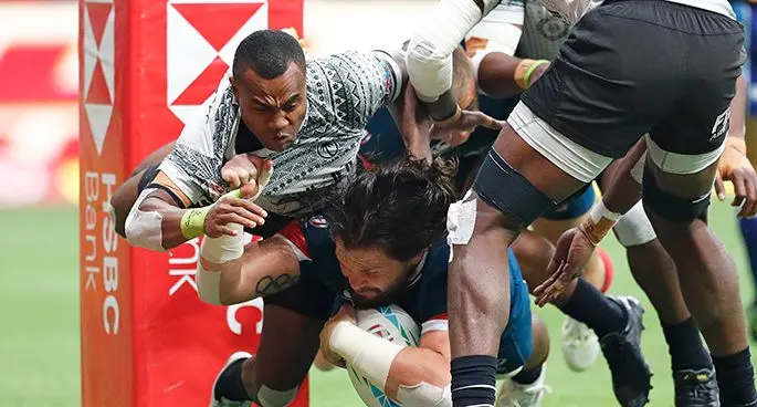 Fiji Airways Fijian 7s winger Alasio Naduva tries to stop USA forward Danny Barrett (with ball) from scoring a try during their 5th Place semifinal clash of the Canada Sevens at the BC Place Stadium in Vancouver on March 9, 2020. Photo; World Rugby