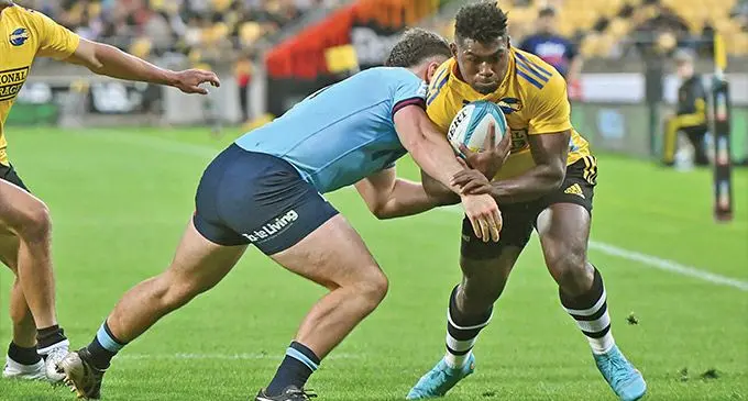 Fiji-born Hurricanes winger Kini Naholo on his way to score the first of his two tries against Waratahs at the Sky Stadium in Wellington on March 17, 2023. Photo: Wide World of Sports