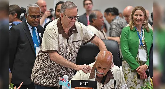 Prime Minister Sitiveni Rabuka gets a friendly shoulder tap from his Australian counterpart, Anthony Albanese, in Tonga.