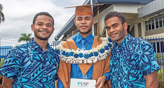 Graduate Pita Matai (middle) flanked by his brothers Sekove Matai (left) and Villame Matai on May 13, 2022. Photo: Leon Lord