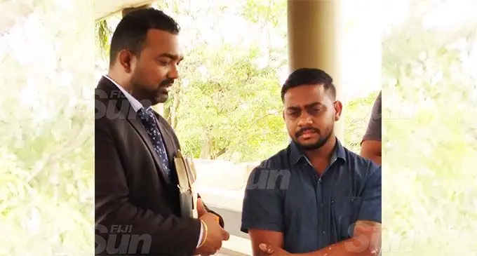 Lawyer, Salvin Nand speaking with his client, Kushal Kumar outside the Magistrates Court in Lautoka on November 11, 2020. Photo: Nicolette Chambers